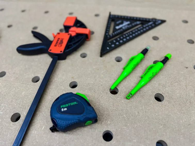 Workshop essentials including a tape measure and pencils